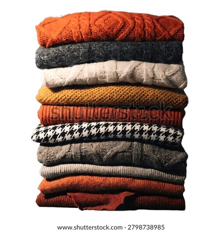 High-quality professional shot of a high stack of folded wool knitted sweaters, isolated on a solid white background. Featuring various warm autumn and winter colors like orange, mustard yellow, beige, olive green, and classic houndstooth patterns. Perfect for winter fashion retail e-commerce stores, clothing catalogs, seasonal wardrobe organization, and cozy lifestyle promotions. Front view.