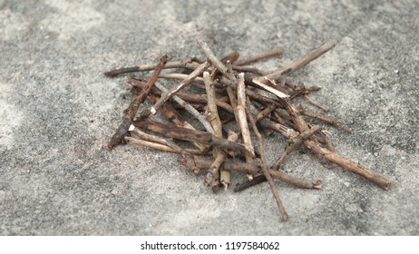 A high-quality shot of a bunch of dry tinders arranged for fire-starting on a natural background, showcasing their rustic appearance and organic texture, ideal for survival, camping, and outdoor use. - Powered by Shutterstock