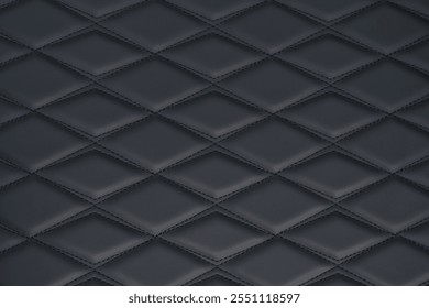 A high-quality texture image of black leather upholstery featuring a classic diamond-stitched pattern. The deep, rich color and intricate stitching create a luxurious and sophisticated appearance.