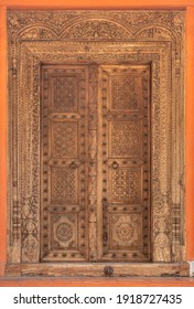 High-resolution Ancient Wood Carved Door. Old Indian Double Door With Knocker Handles And Chain. Traditional Vintage Wooden Door Ornaments. Antique Door Hi-res Texture