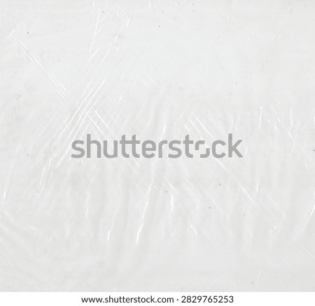 A high-resolution background featuring a clear plastic wrap texture with fine subtle wrinkles, light reflection lines, and creased cellophane film details. Designed with clean, bright surface lighting isolated for full-frame background or overlay use. Ideal for poster mockups, product packaging overlays, CD sleeve aesthetic designs, vinyl cover textures, graphic design art, and modern packaging visual effects.