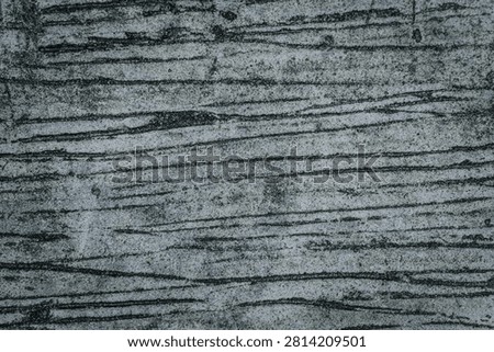 High-resolution background texture of a dark grey concrete surface featuring prominent brushed lines, rough combed cement patterns, and a gritty distressed industrial grunge aesthetic
