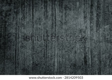 High-resolution background texture of a dark grey concrete surface featuring prominent brushed lines, rough combed cement patterns, and a gritty distressed industrial grunge aesthetic