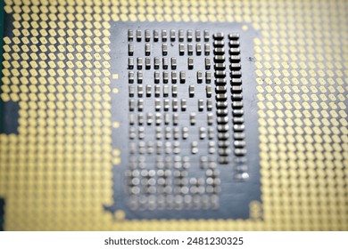 A high-resolution close-up image of a modern computer processor (CPU) showcasing the intricate details of the microchip and its contact pins. Ideal for educational purposes, electronics enthusiasts