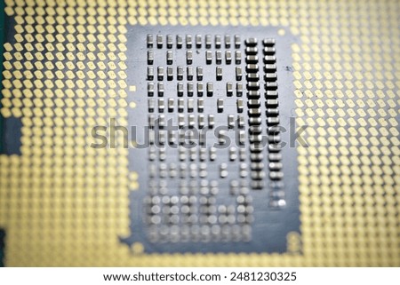 A high-resolution close-up image of a modern computer processor (CPU) showcasing the intricate details of the microchip and its contact pins. Ideal for educational purposes, electronics enthusiasts