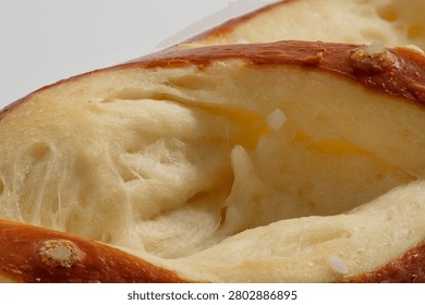 High-Resolution close-up of pretzel soft inside ultra sharp macro and extreme detail of baked pastry cross section texture full frame