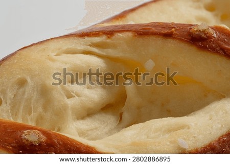High-Resolution close-up of pretzel soft inside ultra sharp macro and extreme detail of baked pastry cross section texture full frame