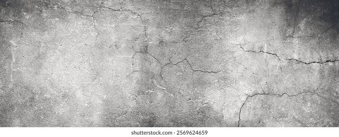 A high-resolution gray concrete wall texture featuring subtle cracks and weathered details, ideal for backgrounds or overlays.