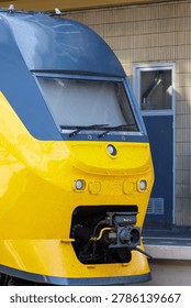 Highresolution Image Capturing Front Of Yellow Train Showing Technical Elements And Industrial Finish