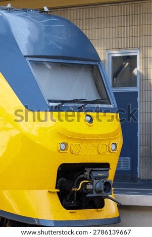 Highresolution Image Capturing Front Of Yellow Train Showing Technical Elements And Industrial Finish