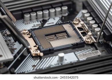 High-resolution image of an open CPU socket on a modern motherboard, detailing the intricate pin arrangement and nearby components.