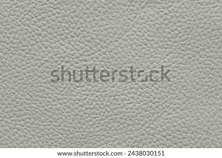 High-resolution image of white leather with a detailed pebbled texture, ideal for backgrounds in luxury design.
