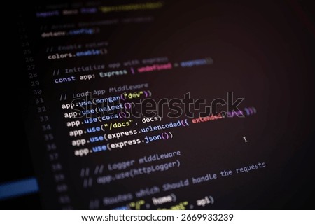 High-resolution macro of Express.js backend code showing middleware configuration for logging, security, and JSON parsing using Helmet, CORS, Morgan, and body parser.