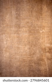 High-resolution rustic brown canvas texture with a vintage woven burlap pattern and dark vignette edges.