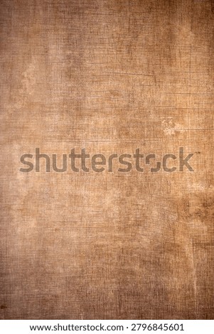 High-resolution rustic brown canvas texture with a vintage woven burlap pattern and dark vignette edges.