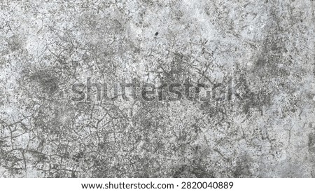 A highresolution texture of weathered gray concrete with intricate cracks and mottled dark spots, showing a rough, industrial, and aged surface