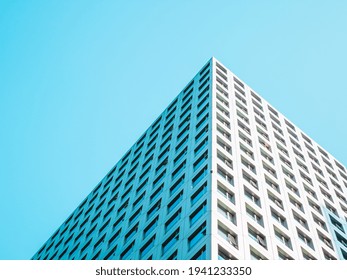 A highrise building against the blue sky