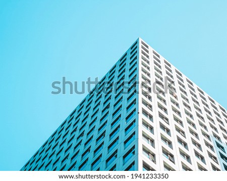 A highrise building against the blue sky