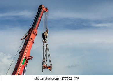 High-rise Crane For Construction On Sky Background. Tower Cranes For Rent With Installation At Construction Site. Sale Tower Crane During Economic Crisis. Crane Job Loss During Pandemic