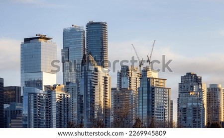 Highrise Residential and Commercial Buildings in Modern Downtown City. Vancouver, British Columbia, Canada. Winter Sunset.