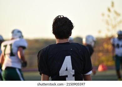 Highschool Football Player Being Thoughtful