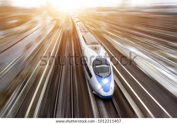 High-speed passenger train travels at
high speed. Top view with motion effect, greased
background