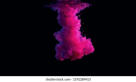 High-speed photography of colored liquids with magenta and cyan lights, in studio with a black background.