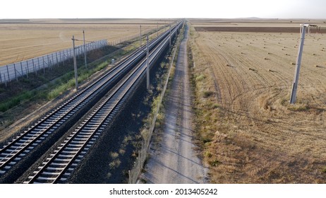 high-speed rail. rails, the road passes through farmland. Railway 