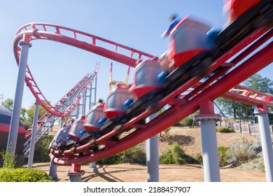 a high-speed ride. A carnival. a roller coaster. A thrilling ride. An amusement park