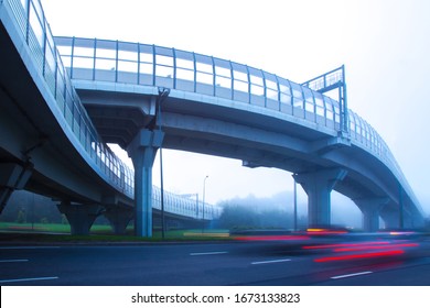 High-speed Roads With Protective Screens. Movement Of Cars In The Fog. High-speed Auto Movement In Different Directions. Organization Of Traffic. Road Infrastructure. Road Junction.