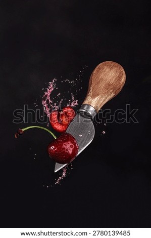 Highspeed studio shot capturing cherry slicing and juice motion