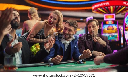 High-Stakes Poker Championship in Casino, Glamorous Players Place Bets, Reveal Cards. Player Triumphs, Celebrating His Jackpot Win against the Odds. Beautiful People Relaxing.