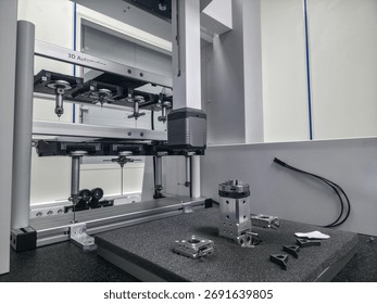 High-tech 3D automated testing machine is set up in a laboratory, featuring precision instruments for analyzing various components on a work surface, showcasing innovation in testing technology.