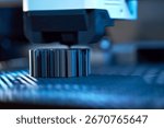 A high-tech 3D printer works efficiently in a workshop, layering materials to form an intricate object while ambient blue lighting highlights the creative atmosphere.
