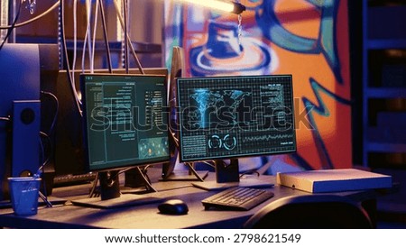 High-tech computer system in hidden underground base used for international espionage, PC equipment used for intercepting soundwaves in empty hideout with graffiti painted walls.
