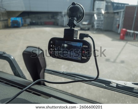 A high-tech dashboard camera mounted in an HGV (lorry truck), recording a clear view of the road during driving. Dashcam are essential for fleet safety, accident documentation, and driver monitoring