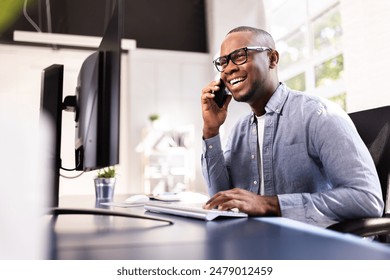 High-Tech Real Estate Executive Making a Cheerful Call at His Corporate Office Using Smart Devices and Internet Connectivity. - Powered by Shutterstock