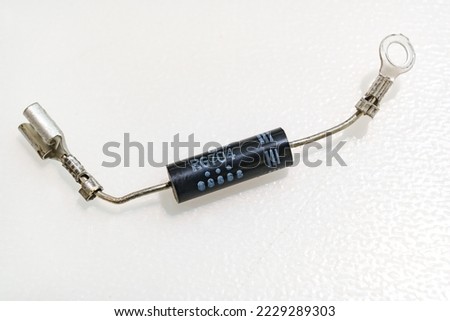 High-voltage diode on a white background. Microwave oven detail. repair and spare parts for electrical appliances.