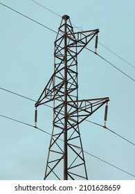 High-voltage Electric Pole City Electrical Grid In The Morning Light