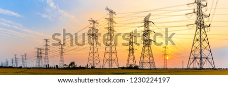 high-voltage power lines at sunset,high voltage electric transmission tower