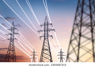 high-voltage power pylons with luminous wires against the backdrop of the sunset sky. energy infrastructure concept - Powered by Shutterstock