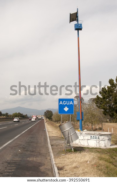 Highway 150 D  from Puebla to Mexico city,with a\
sign for water stop