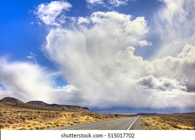 Highway 50 In Nevada Under Storm Clouds.