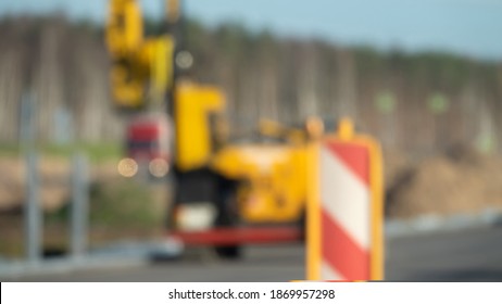 Highway abstraction. Road construction, road equipment and road signs. Blurred to make it impossible to identify the technique and as a photographic technique, formalized image, glitter