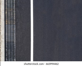 Highway Background, Roadside Top View. Road View From Above, Black Asphalt, White Dividing Strip, Concrete Curb, Rainwater Drainage System, Runoff, Rubble.