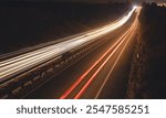 Highway car light trails at night.