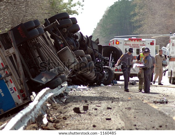 Highway crash\
wreck with truck, and rescue\
workers