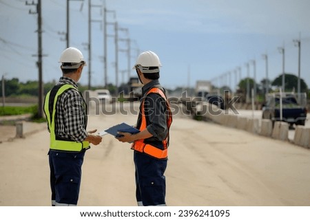 Highway engineers discuss plans for construction improvement based on roadworks. Soil Fill, Backfill Compaction for Sub base, Base Course, Surveyor Engineer inspector in highway construction.