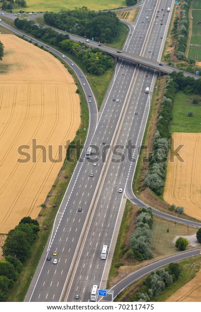 Highway with exit road Autobahn\
traffic transport transportation portrait format aerial\
landscape