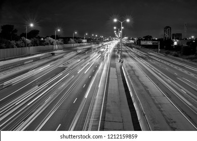 Highway  Gardiner Expressway In Toronto Ontario In Black And White With Tail Lights At Dawn Before Sunrise